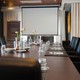 Boardroom in block setup with TV screen and flipchart